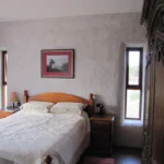 Bedroom with timber bed and headboard