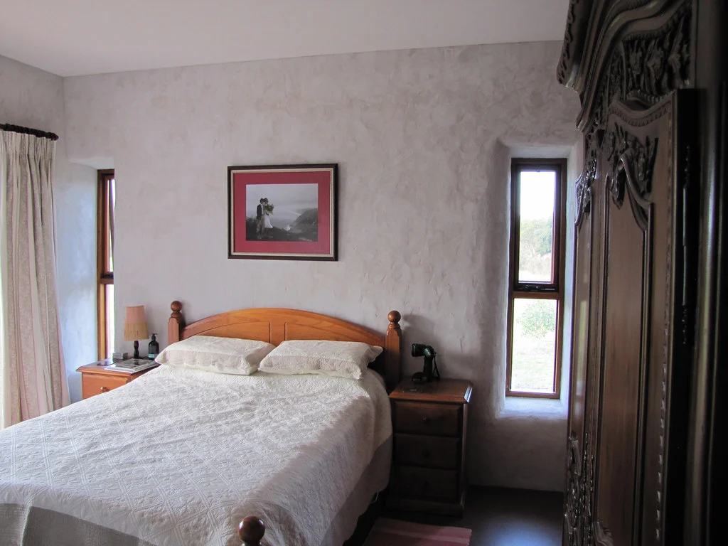 Bedroom with timber bed and headboard