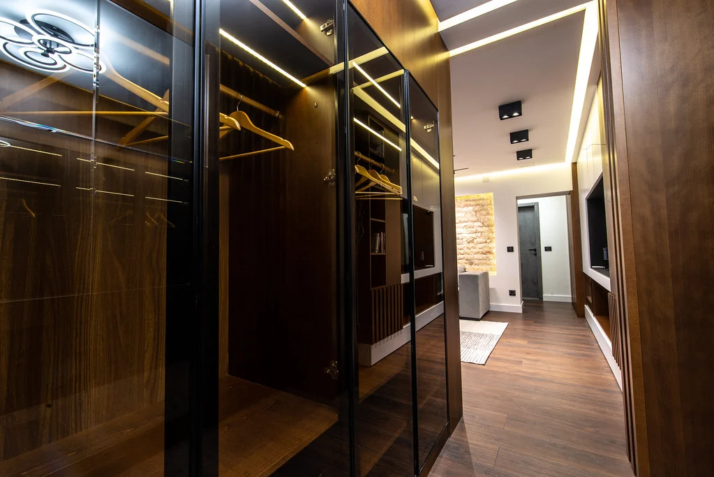 Wood storage closet with integrated shelving